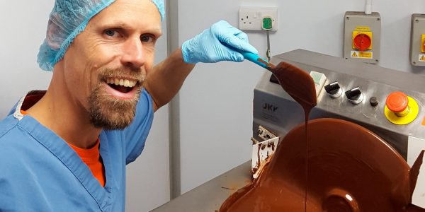 Photo of Linus-Gorpe making chocolate in factory